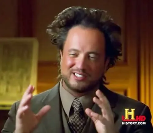 Giorgio Tsoukalos with wild upswept hair, gesturing as he speaks