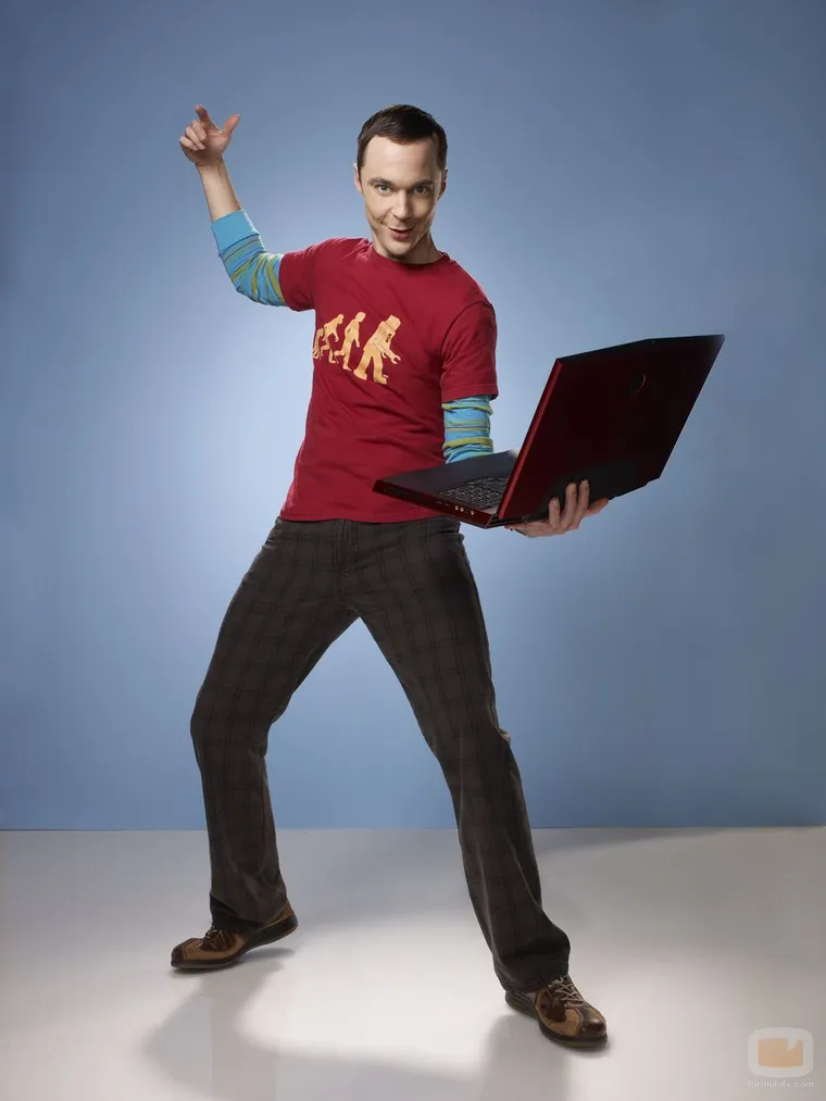 Sheldon Cooper in a red superhero T-shirt, posing triumphantly