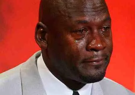 Michael Jordan in a suit, crying