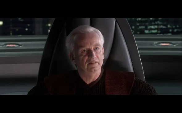 Chancellor Palpatine sitting in his office chair, looking smug