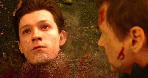 Peter Parker in the Spider-Man suit without a mask, looking frightened