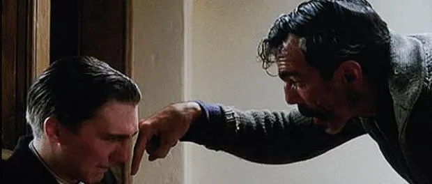 Daniel Day-Lewis as Daniel Plainview in a bowling alley, shouting