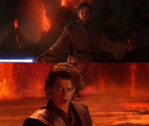 Obi-Wan above Anakin on a riverbank of the lava planet Mustafar, Anakin glaring up from below