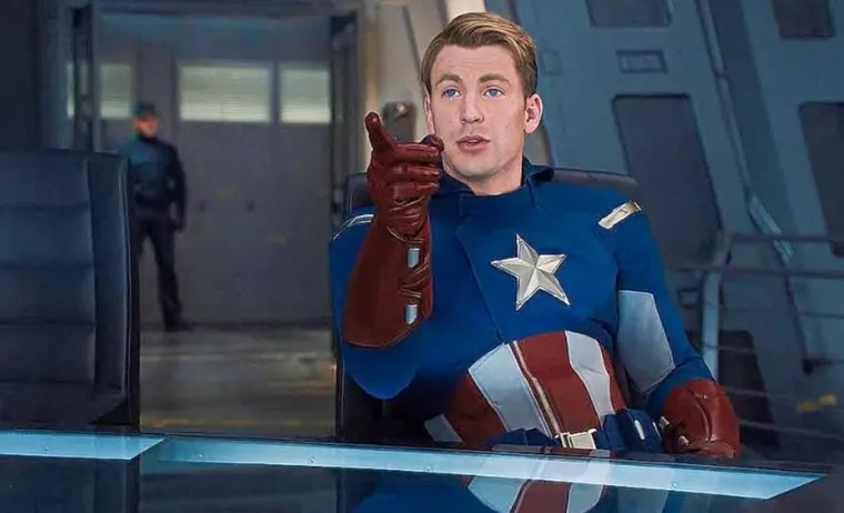 Steve Rogers in his Captain America suit, smiling and pointing