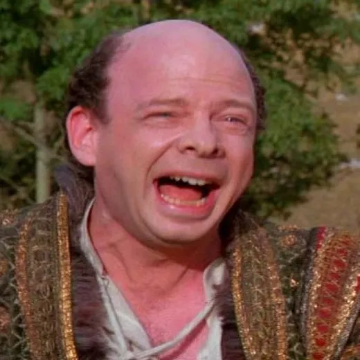 Vizzini, a short balding man, shouting with his mouth wide open