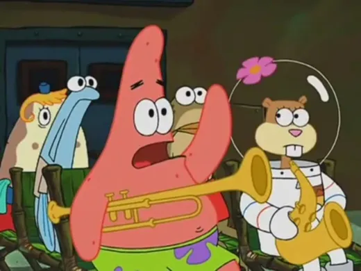 Patrick Star raising his hand in a band rehearsal while Squidward stands at the front