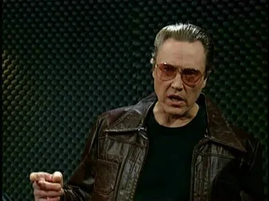 Christopher Walken in a leather jacket in a recording studio