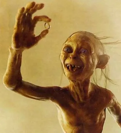 Gollum, a thin pale creature, reaching out with his hands