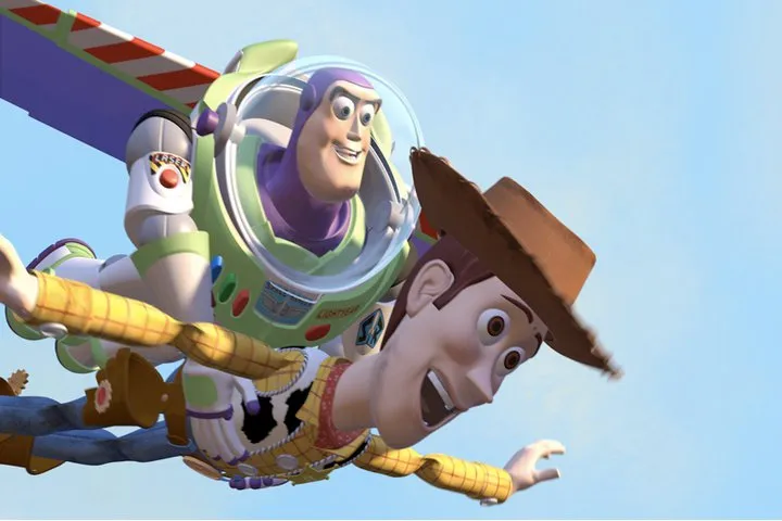 Buzz Lightyear flying with Woody hanging on, arms outstretched