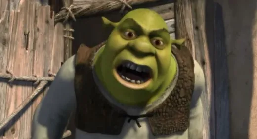 Shrek leaning forward and shouting angrily